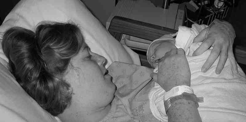 Here's Mommy with her newest bundle of joy.