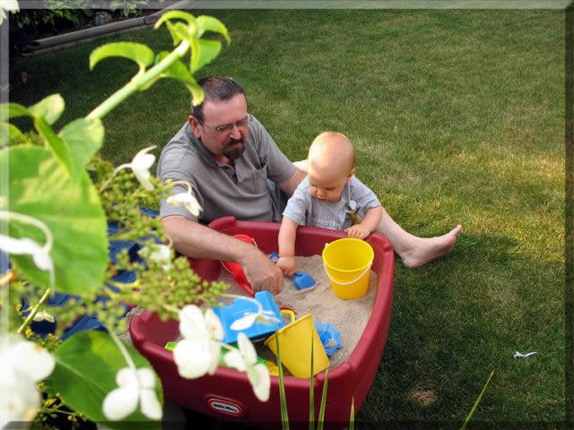 Poppa & Will playing in the sand-box