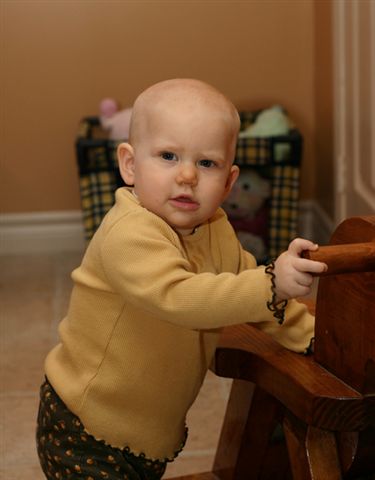 Olivia will be 1 year old on Nov. 19th- she stands up all the time.
