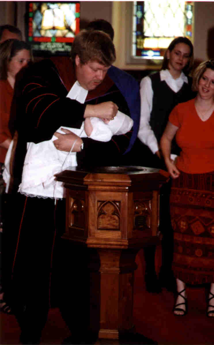 Reverend Dr. Andrew Human baptizing Ashlynn Pearl
