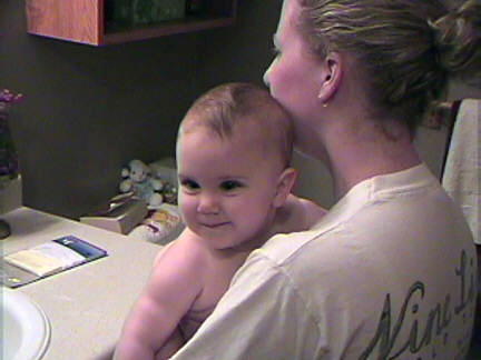 Getting ready for her bath. I just love her mischievous smile.