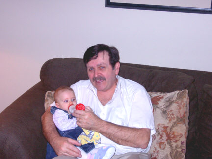Here's Poppa giving Ashlynn a baba.