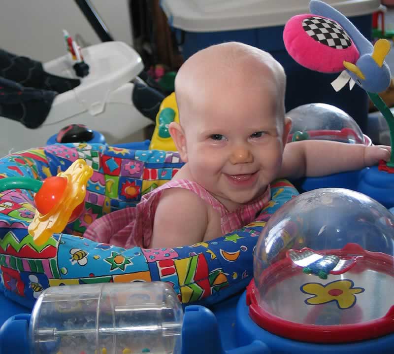 Surrounded by her toys- Olivia loves these activity centers.