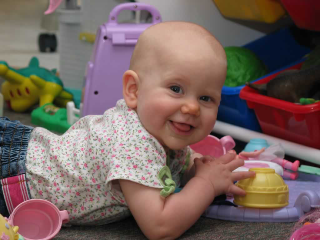 Olivia's almost crawling- she's been rolling herself over for over a month.